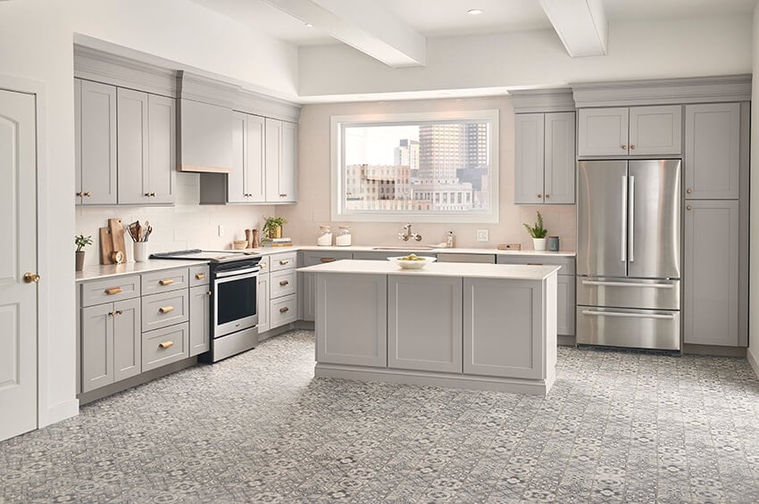 Bowery Pewter cabinets with an island and a patterned tile floor