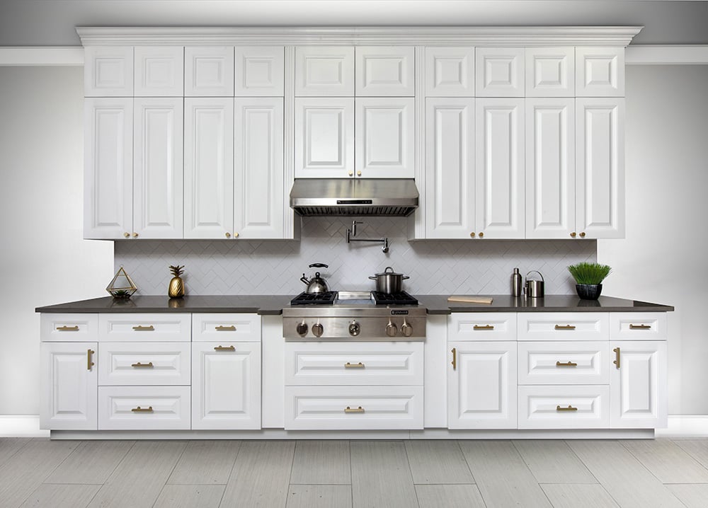 Classic White raised panel cabinets with a dark countertop