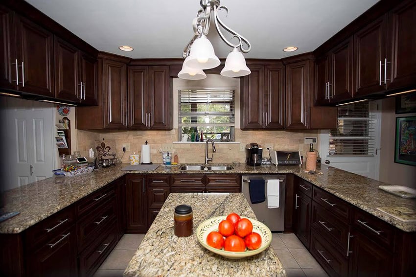 Dark Caramel cabinets around a granite island