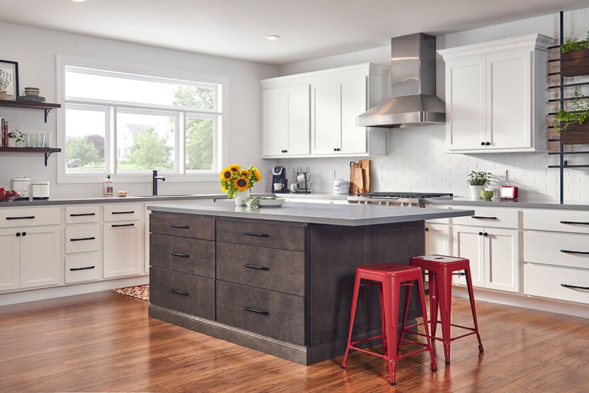 Madison Brown island with white perimeter cabinets and red bar stools