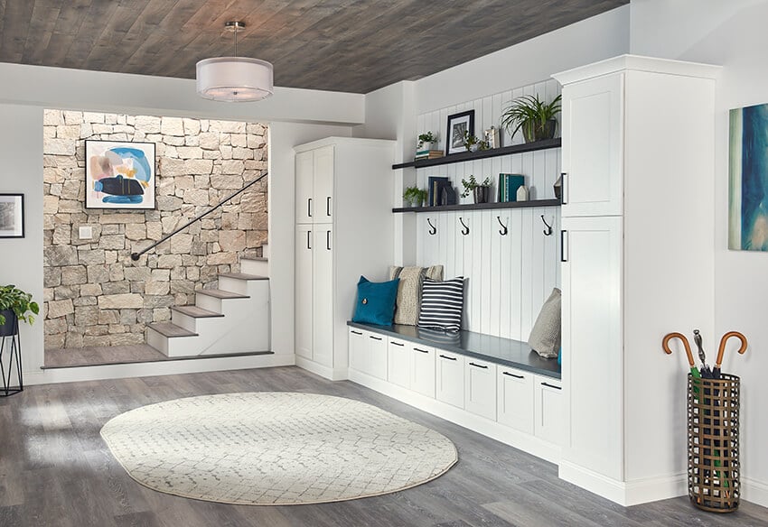 Madison White cabinets built into a mudroom bench with hooks and shelves