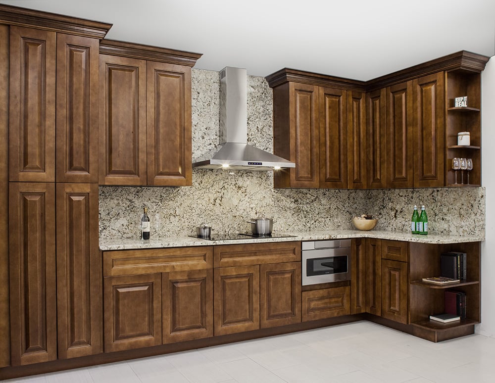 Maduro raised panel cabinets with a granite backsplash