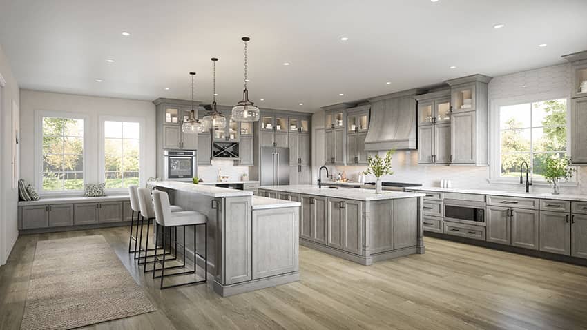 Oxford Mist gray stained cabinets in a large kitchen with two islands and pendant lights