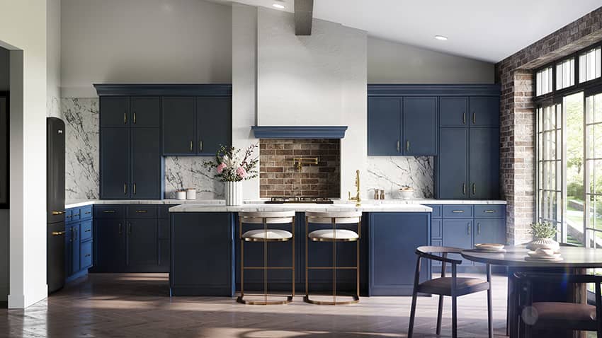 Petit Blue navy cabinets with a white marble backsplash and a dining table