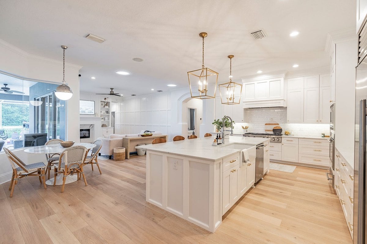Shaker Blanco white cabinets in an open kitchen with a large island