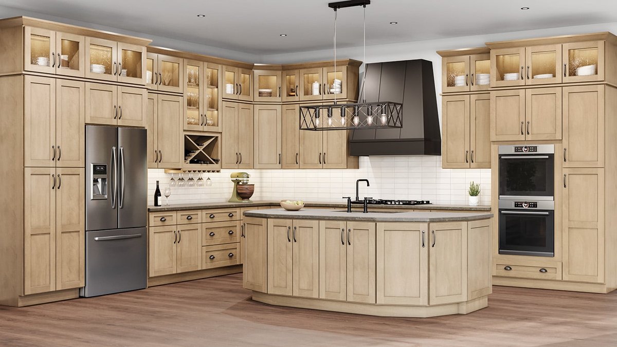 Shaker Honey cabinets with glass upper doors and a curved island