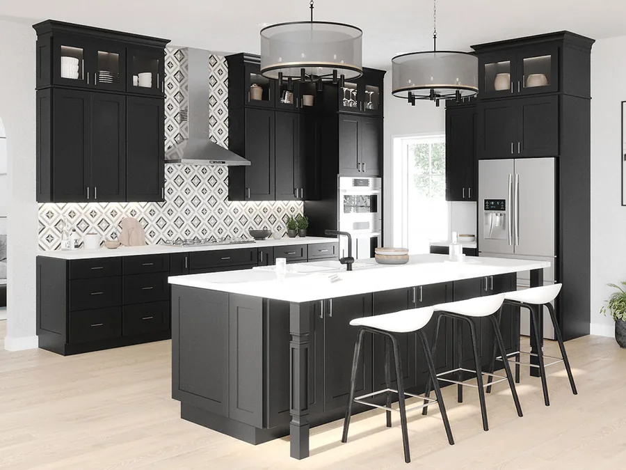 A modern kitchen in black shaker cabinets with a white island