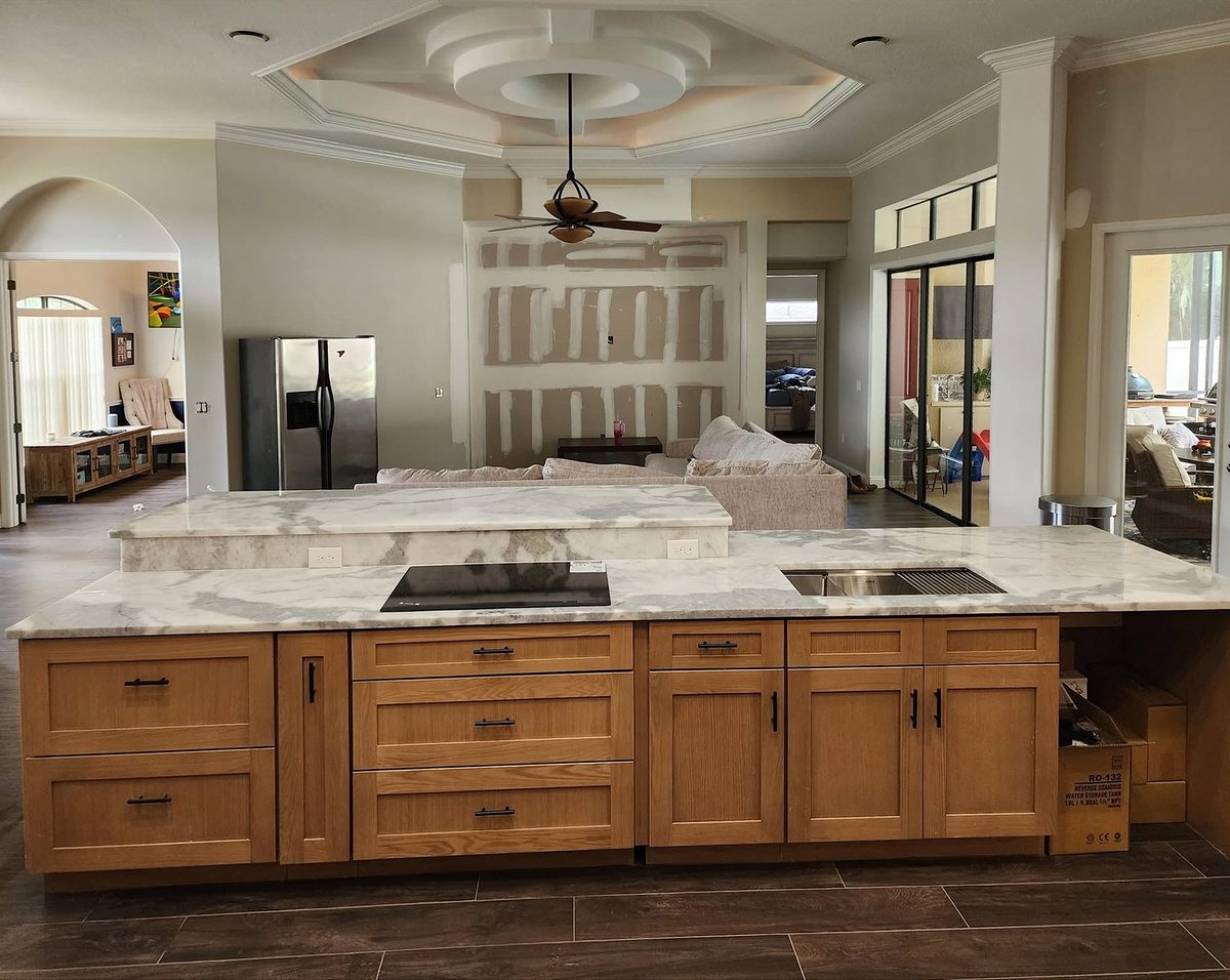 Homestead Oak kitchen island with drawers and a marble countertop