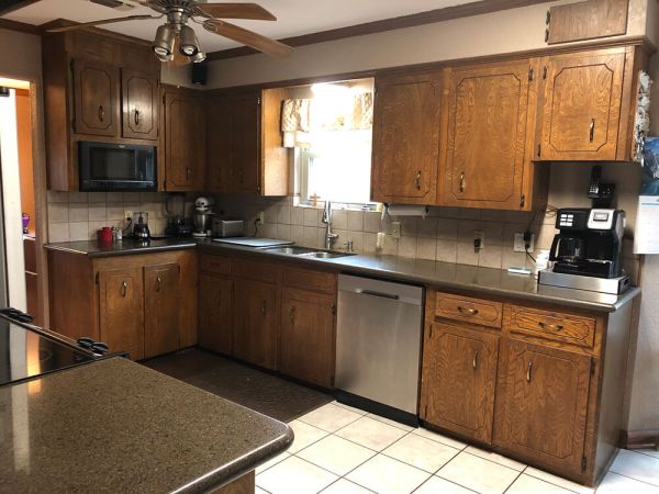 Kitchen with dated oak cabinets before the remodel