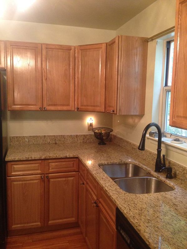 Carol T.’s kitchen after, with Country Oak Classic cabinets