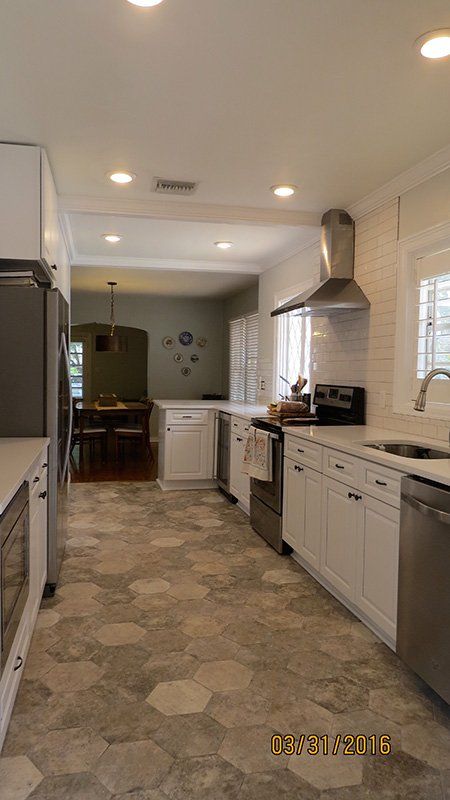 Christy L.’s kitchen after, with Gramercy White cabinets