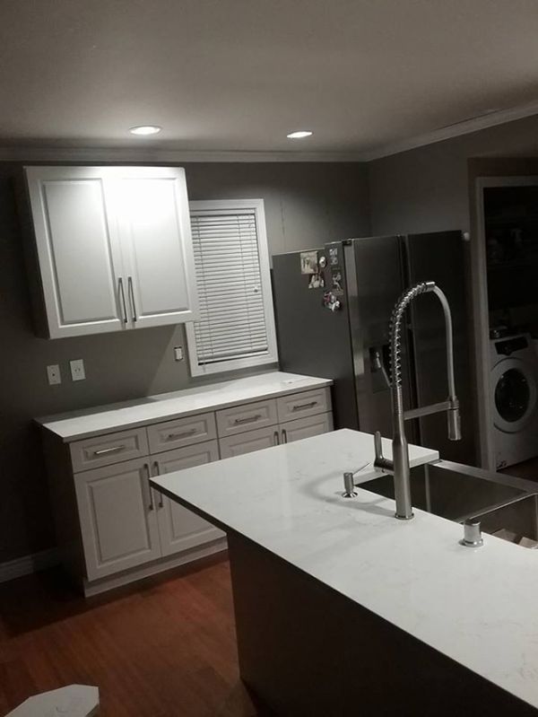 Jose G.’s kitchen after, with Gramercy White cabinets