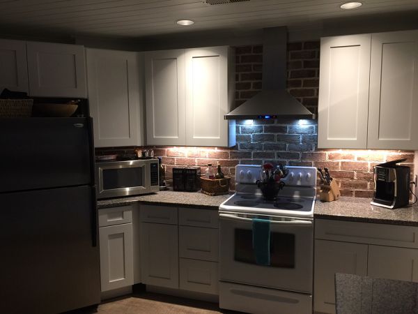 Robin R.’s kitchen after, with Ice White Shaker cabinets