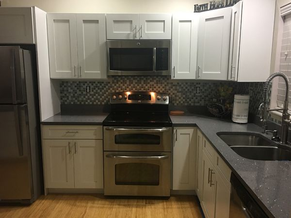 Sean G.’s kitchen after, with Ice White Shaker cabinets