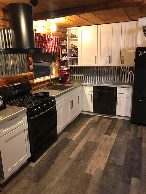 Charlie D.’s kitchen after, with Ice White Shaker cabinets