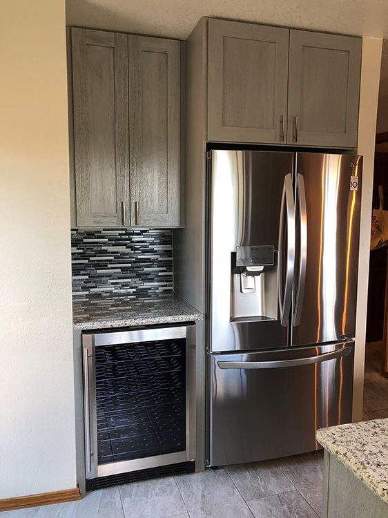 Cyndi A.’s kitchen after, with Nova Light Gray cabinets