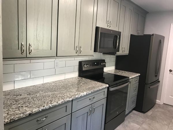 Rose B.’s kitchen after, with Nova Light Gray cabinets
