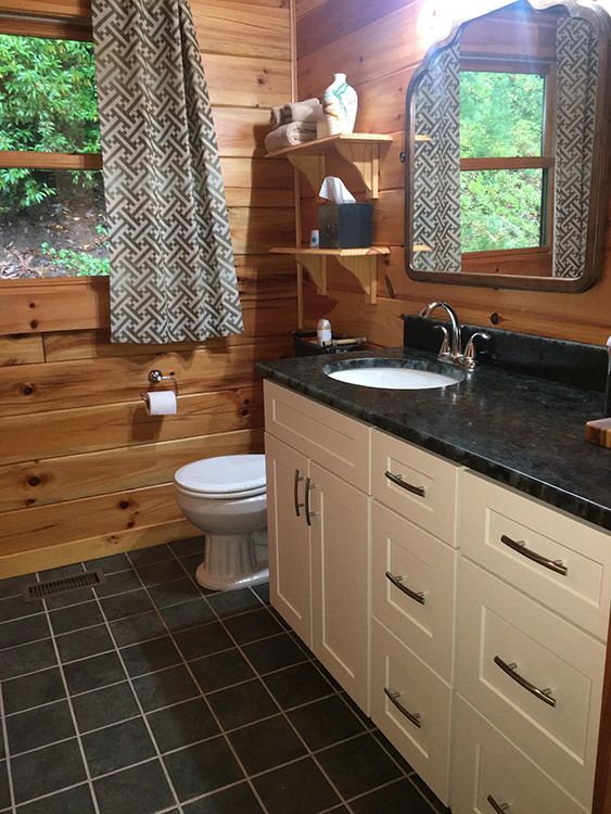 Kathryn W.’s bathroom after, with Shaker Antique White cabinets