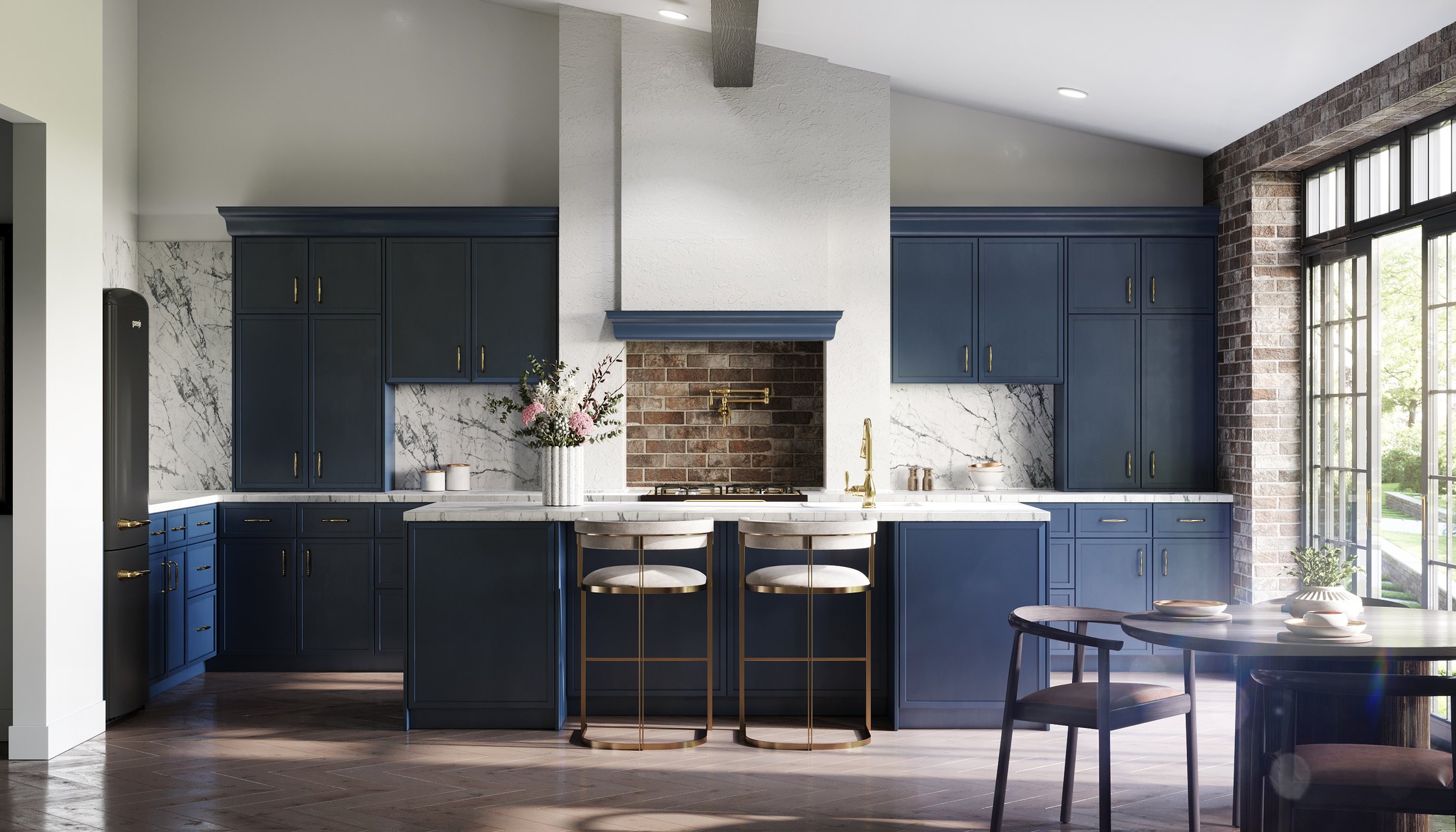 A navy blue kitchen with brass hardware, a marble backsplash and a brick range wall