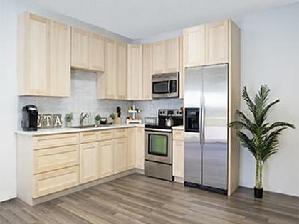 A kitchen in unfinished kitchen cabinets