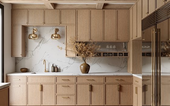 A light oak shaker kitchen with a marble backsplash and brass sconces