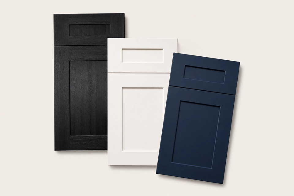 Full-size cabinet door samples in black, white, and navy shaker styles