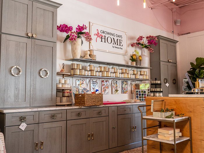 Nova Light Gray cabinets lining the walls of a retail shop