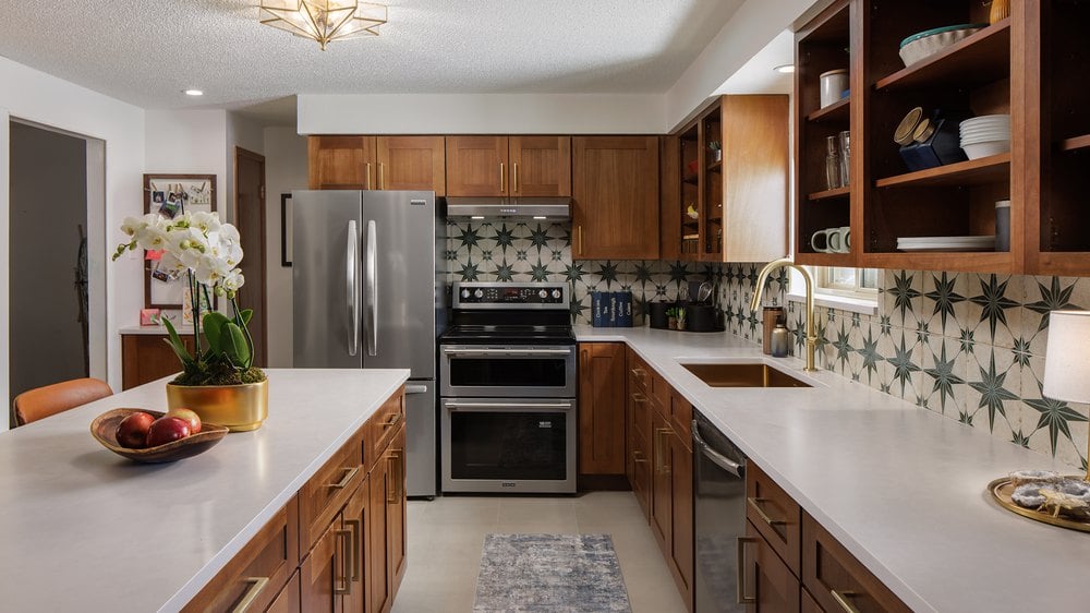 Woodland Brown Shaker cabinets with open shelves and a star tile backsplash
