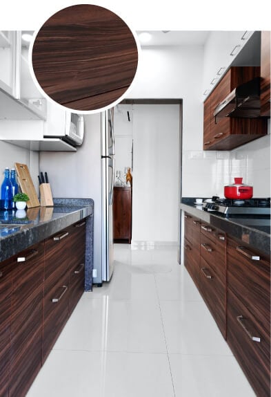 Chocolate stained bamboo kitchen cabinets with black countertops.