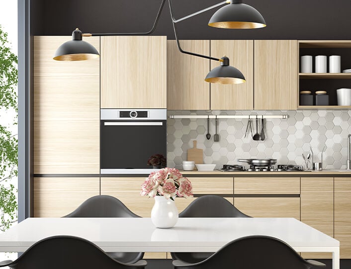 Kitchen with bamboo kitchen cabinets with a smooth finish and a honeycomb tile backsplash.