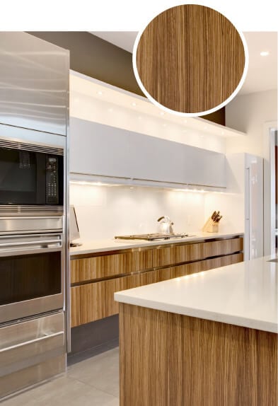 Modern kitchen with all white countertops and brown bamboo cabinets.