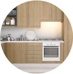 Natural warm brown bamboo cabinets with white countertops.