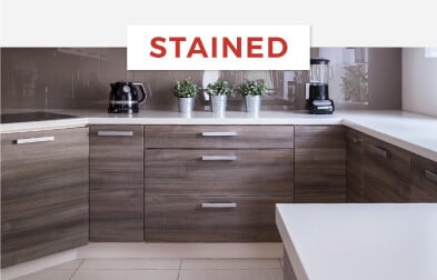 Minimalist kitchen with stained bamboo cabinets in gray.