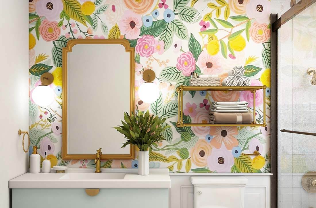 Small bathroom with colorful floral wallpaper and orb glass sconces.
