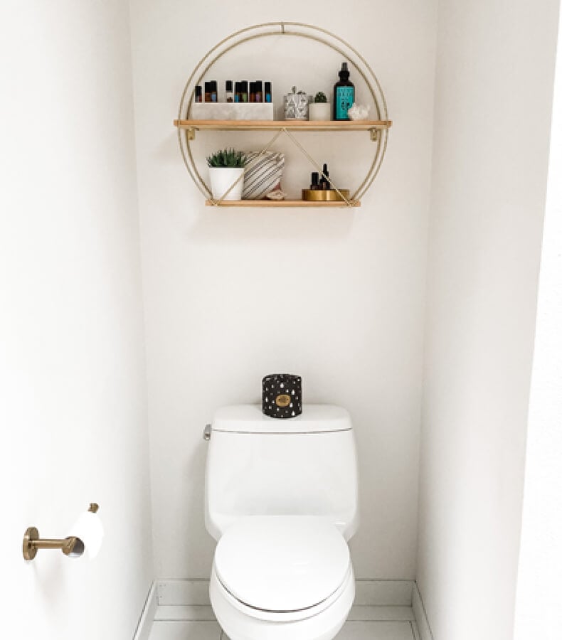 Small enclosure for toilet with floating shelf.