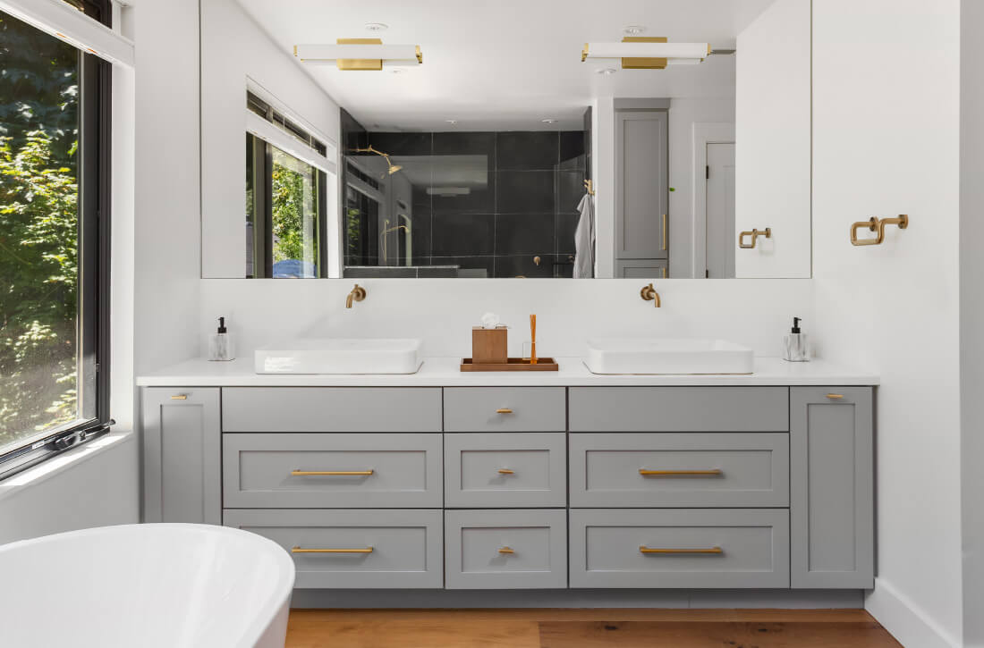 Modern bathroom vanity with frameless cabinets.