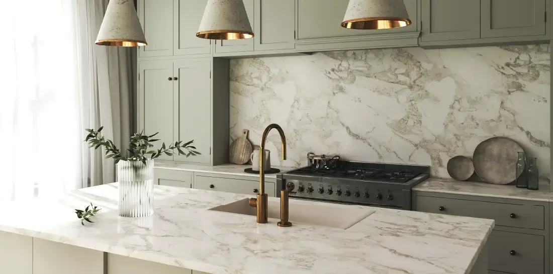 Kitchen with white marble contact paper counters.