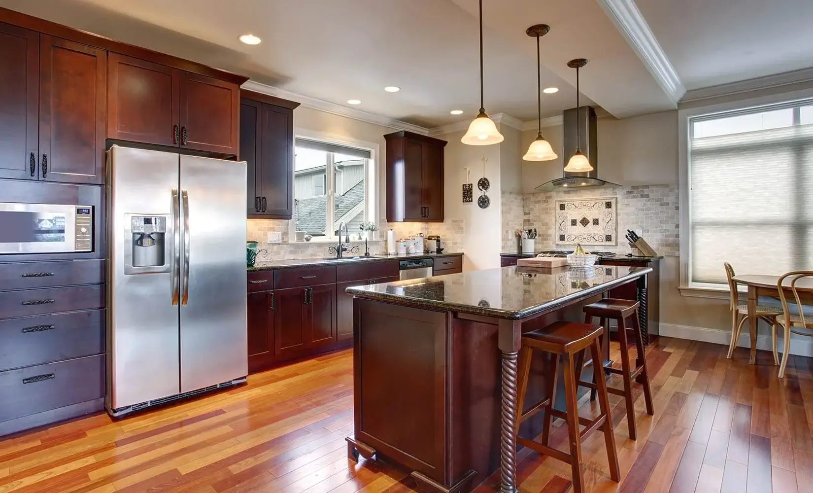 Kitchen with dark brown stained kitchen cabinets.