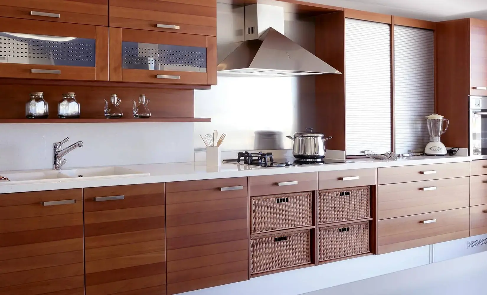 Kitchen with dark wood veneer cabinet finish.