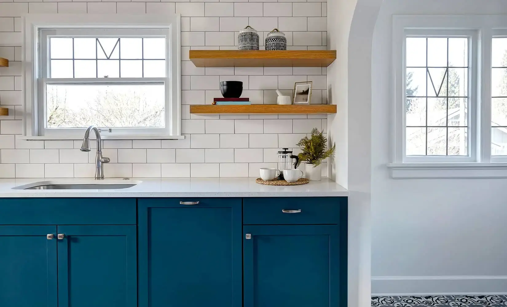 Kitchen with navy painted cabinets.