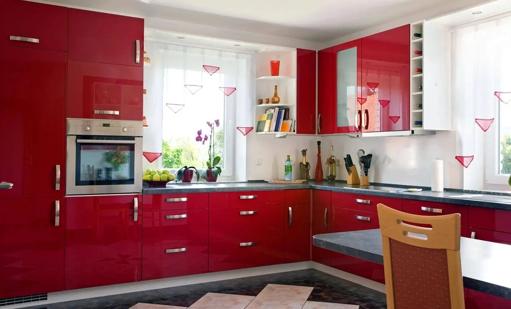 Kitchen with bright red lacquer cabinets.