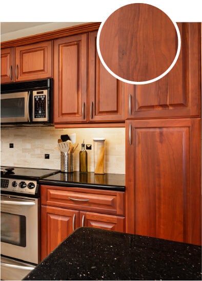 Kitchen with warm brown cherry wood cabinets.