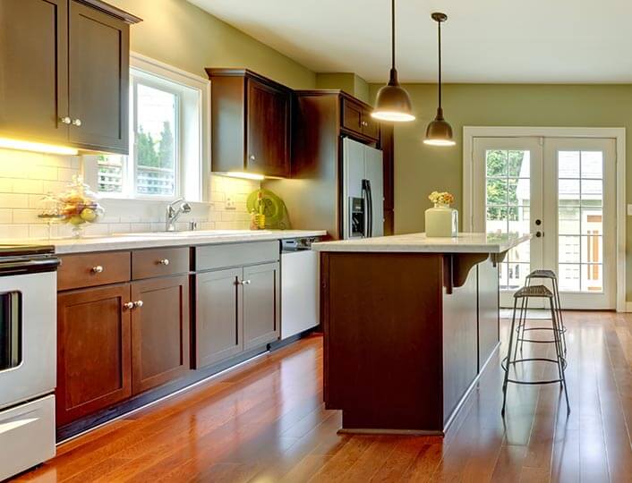 Minimalist kitchen with red-cherry cabinets.