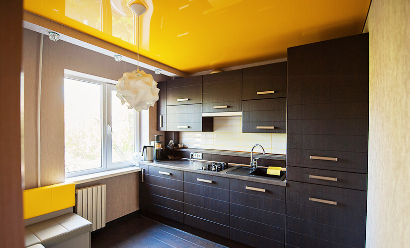 Kitchen with a painted ceiling for a unique pop of color.