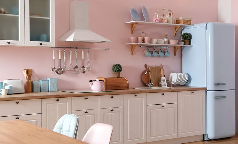 Kitchen with pastel colored appliances.