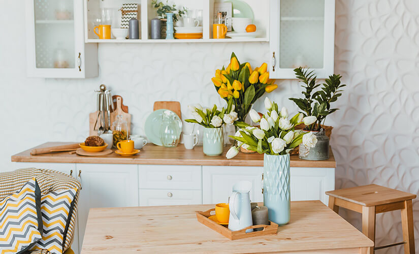 Plants and flowers liven up a colorful kitchen.