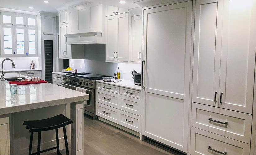 kitchen with white shaker cabinets.