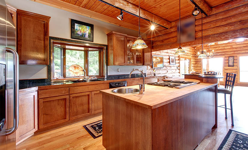 Craftsman kitchen with wood cabients and ceiling.