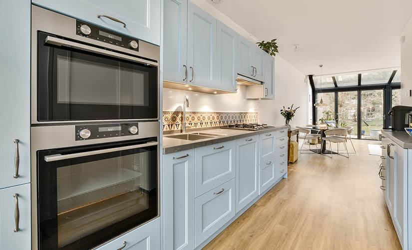 Craftsman kitchen with blue pastel cabinets.