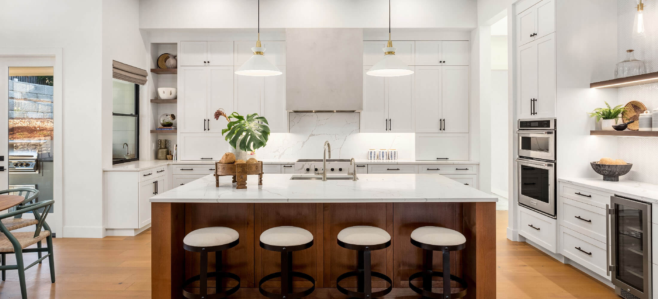 Craftsman kitchen with white cabinets and island.